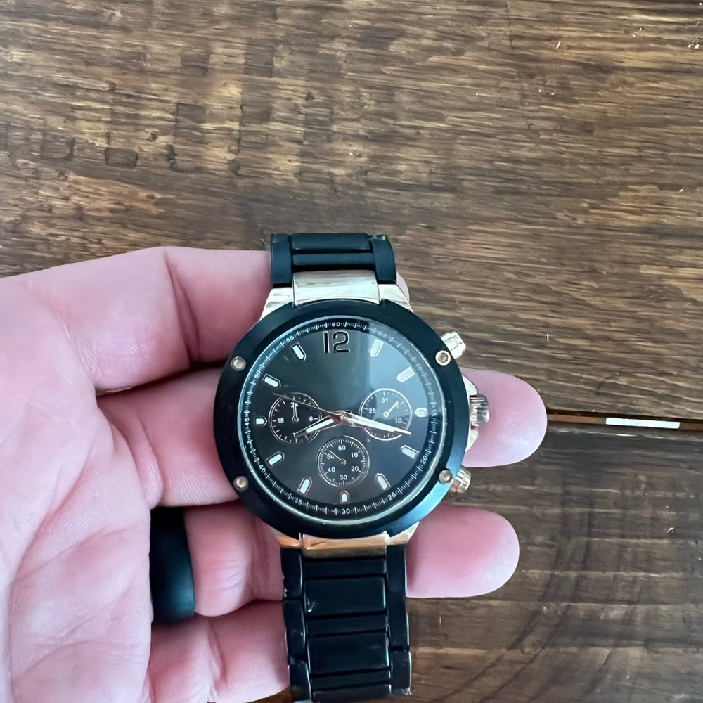 Black Aldo watch.